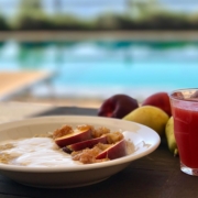 Yoga in Italy delicious breakfast with Amaranth porridge, sliced sun-ripened nectarines and fresh yogurt together with a freshly squeezed juice