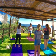 Yoga in Italy - practicing afternoon yoga up at outdoor yoga platform.